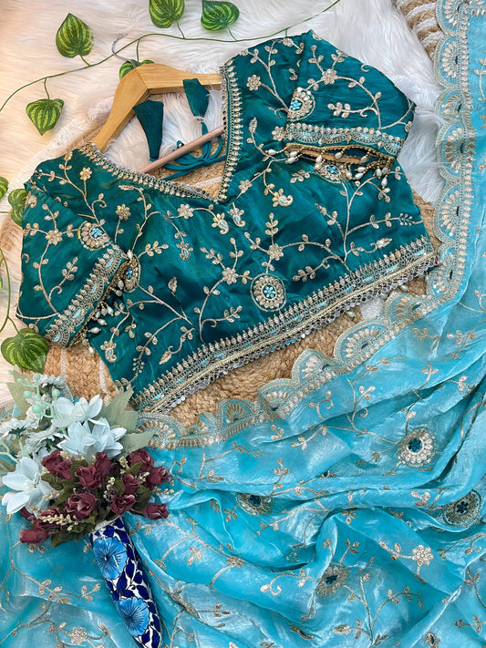 Aqua Blue Organza Saree with Teal Embroidered Velvet Blouse