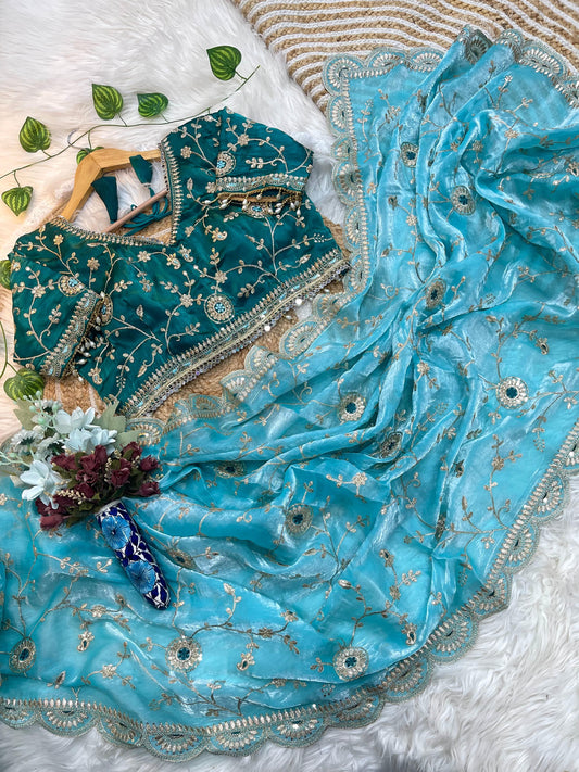 Aqua Blue Organza Saree with Teal Embroidered Velvet Blouse